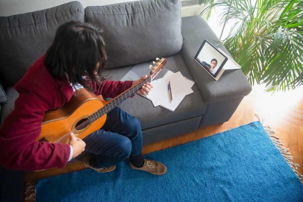 Virtual music lessons. Learning to play the guitar.
